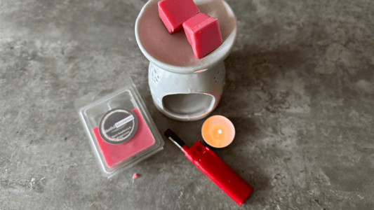 Blog post Instructions on how to use our wax melts. Image contains red wax melts in a tealight burner with a clamshell wax melt and a lite tealight