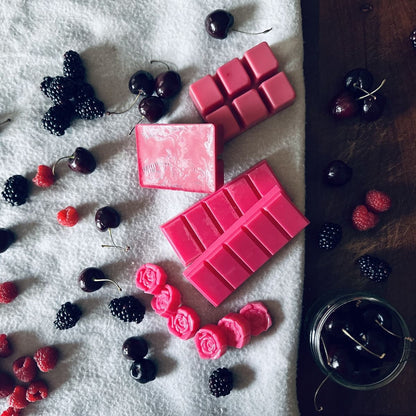 Fruity scented soy wax melts surrounded by black cherries, raspberries and blackberries