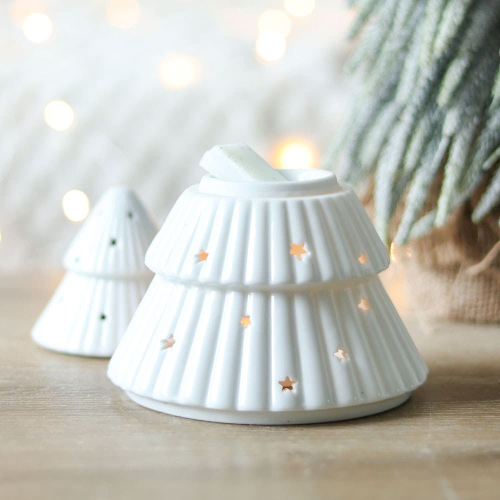 Christmas tree wax melt and oil burner in a winter wonderland setting