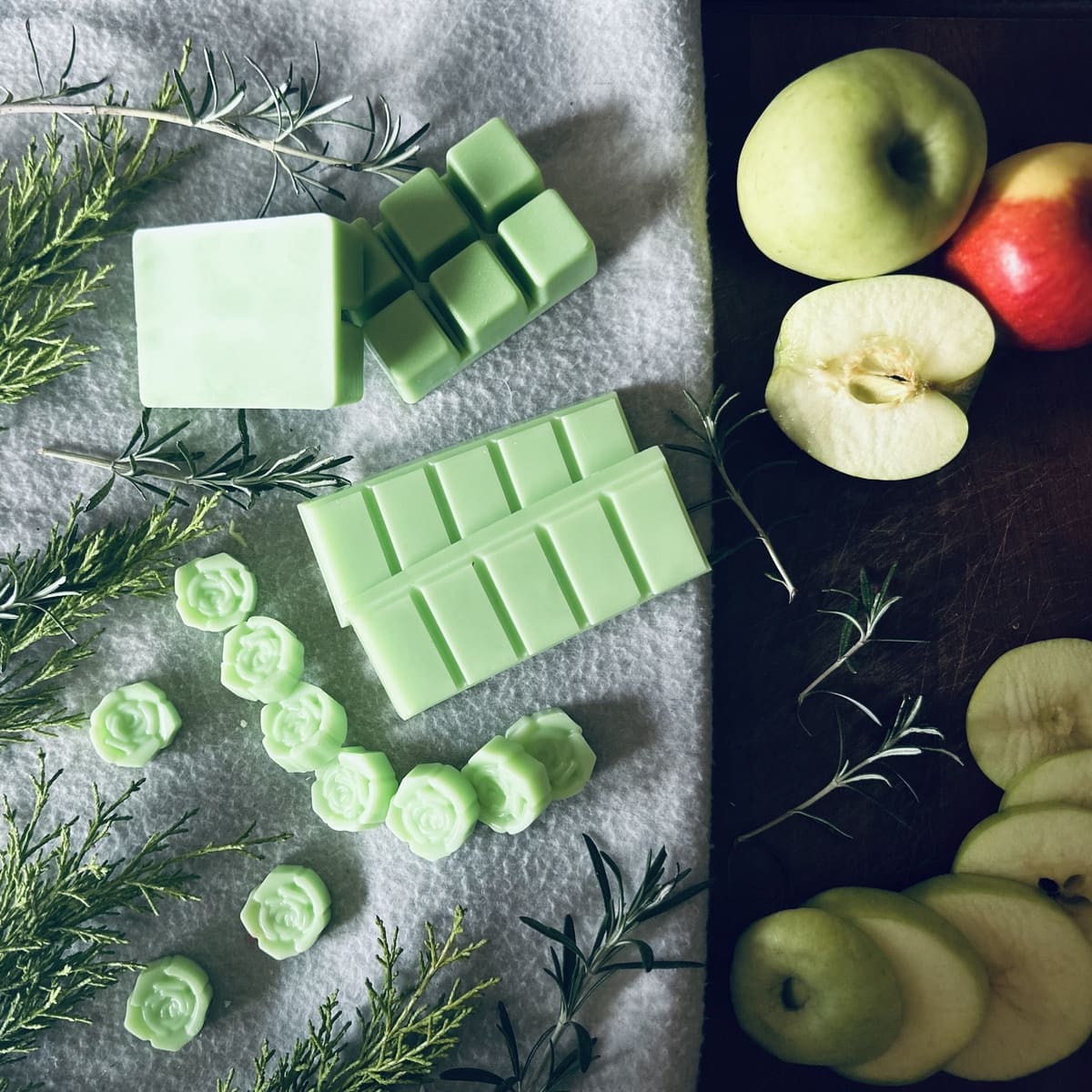 Fruity soy wax melts surrounded by green and red apples