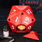 Red die-shaped wax melt burner inspired by the stranger things with a tealight inside on a dark wood surface with the dice triangle lid laid next to the burner.