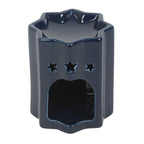 Navy blue ceramic wax melt burner with star designs on a white background