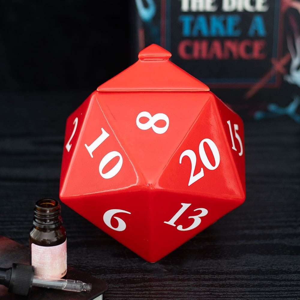 Red die-shaped wax melt burner inspired by the stranger things with numbers on sitting on a dark wood surface.