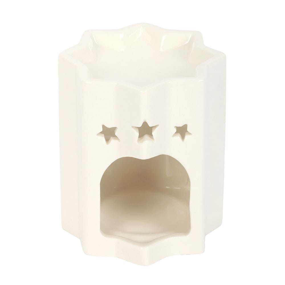 White ceramic star shaped wax melt burner with star shaped cutouts above the tealight hole on a white background.