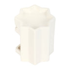 White ceramic star shaped wax melt burner on a white background.
