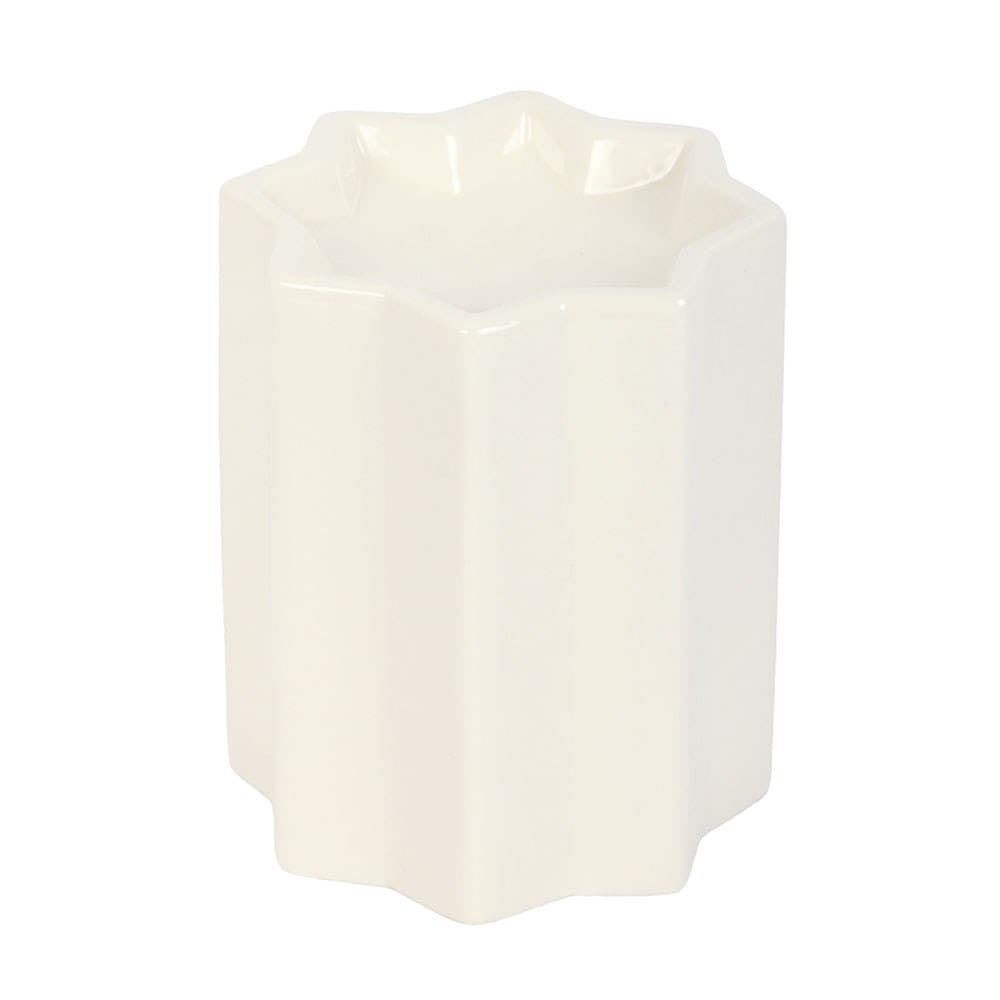 White ceramic star shaped wax melt burner on a white background.