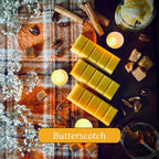 Yellow Butterscotch scented wax melts on a checkered cloth with candles cinnamon sticks an fudge.