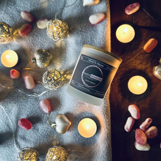 Snow fairy soy candle in a cosy setting surrounded by peardrops, fairy lights and tea lights