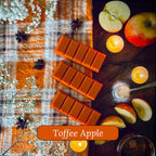 Toffee Apple snapbar wax melts surrounded by apples, and candles on a checkered fabric background.